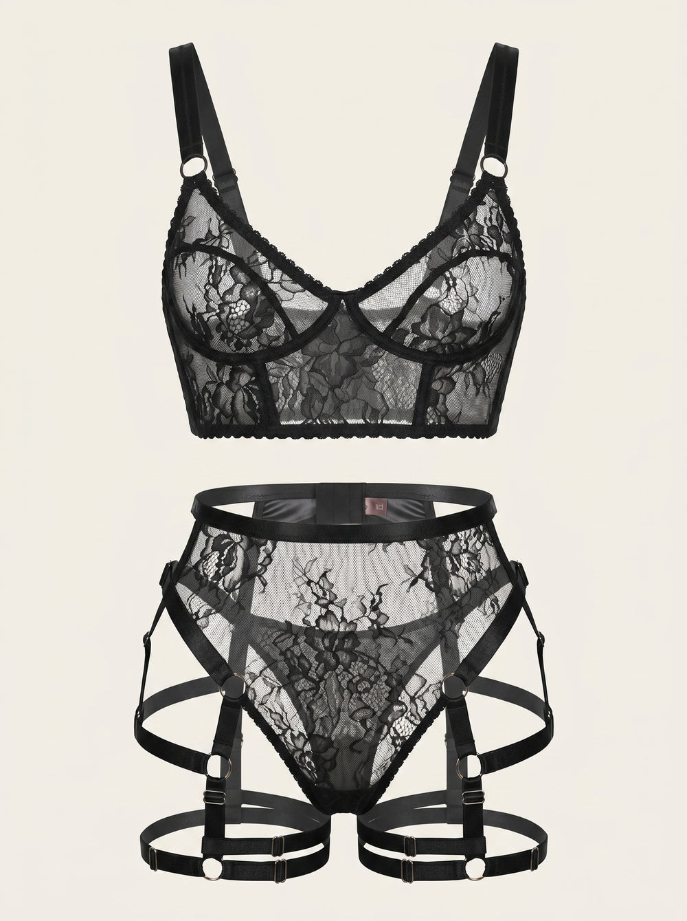 Completo di lingerie nero con spalline in pizzo e design trasparente
