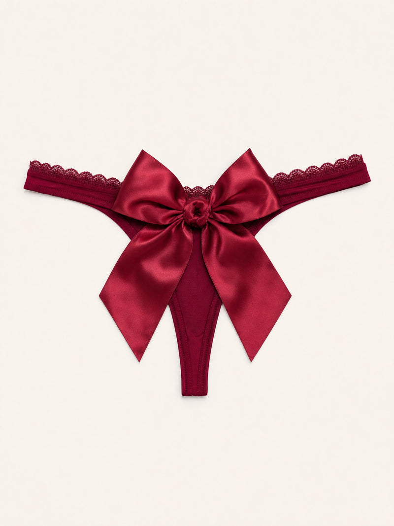 Slip rosso scuro in raso con bordo in pizzo e dettaglio a fiocco