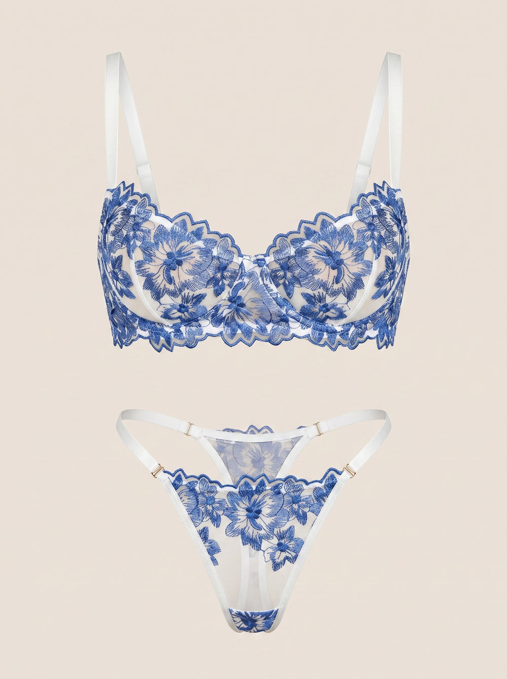 Set di lingerie blu in pizzo floreale con eleganti dettagli a spalline