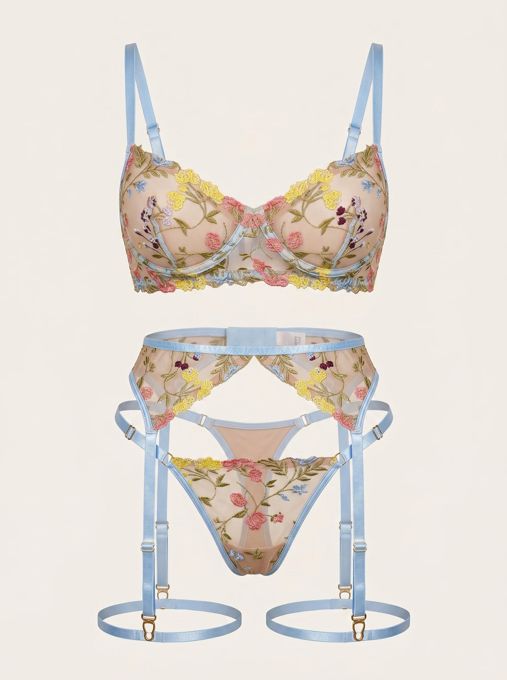 Set di lingerie in tulle con ricami floreali dall'eleganza trasparente