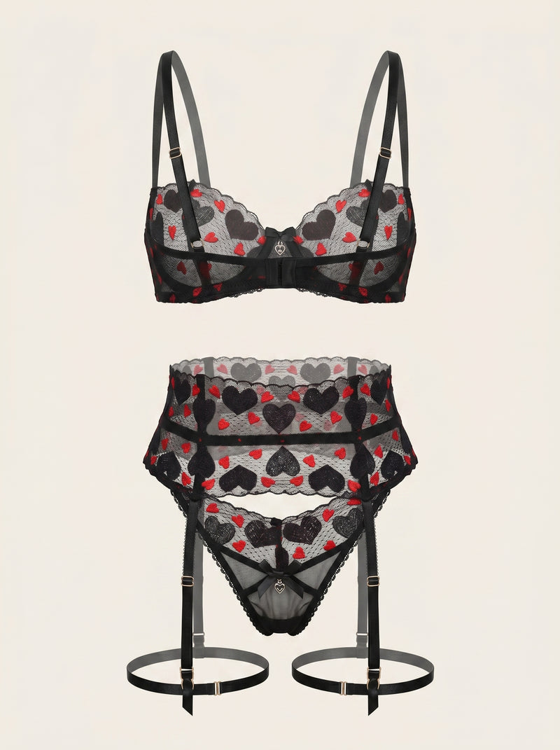 Completo di lingerie in tulle nero ricamato con cuori e reggicalze strappy